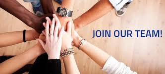 Join our Team - hands stacked together in a team huddle