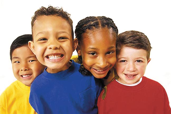 Children of different ethnicities smiling