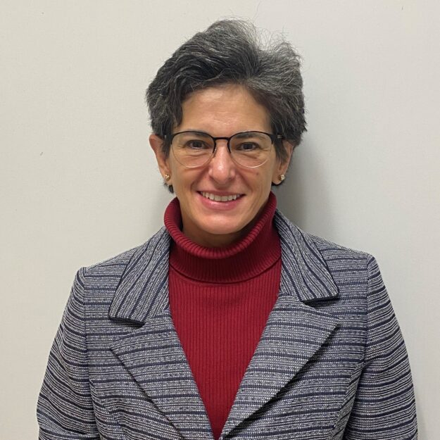 Maria A woman with short, gray hair